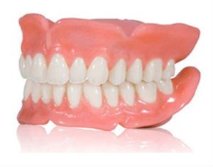 Full set of custom dentures with natural-looking gums and teeth, showcasing O2 Dental Group restorative solutions.