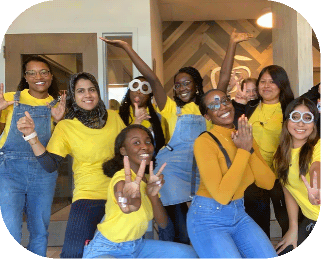 Playful O2 Dental Group staff wearing Minion-themed costumes during a festive team celebration in the office.