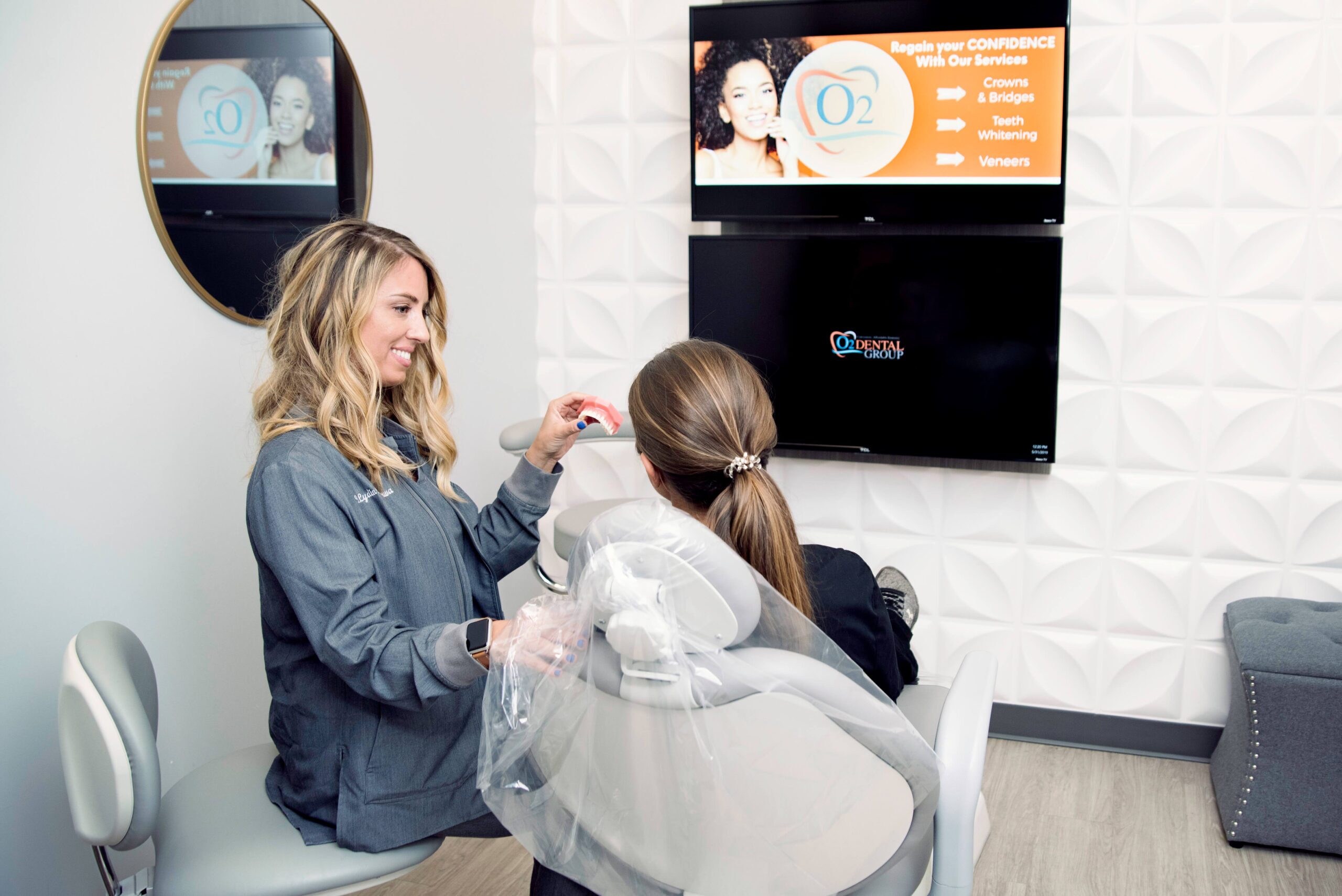 Dentist providing a patient consultation at O2 Dental Group