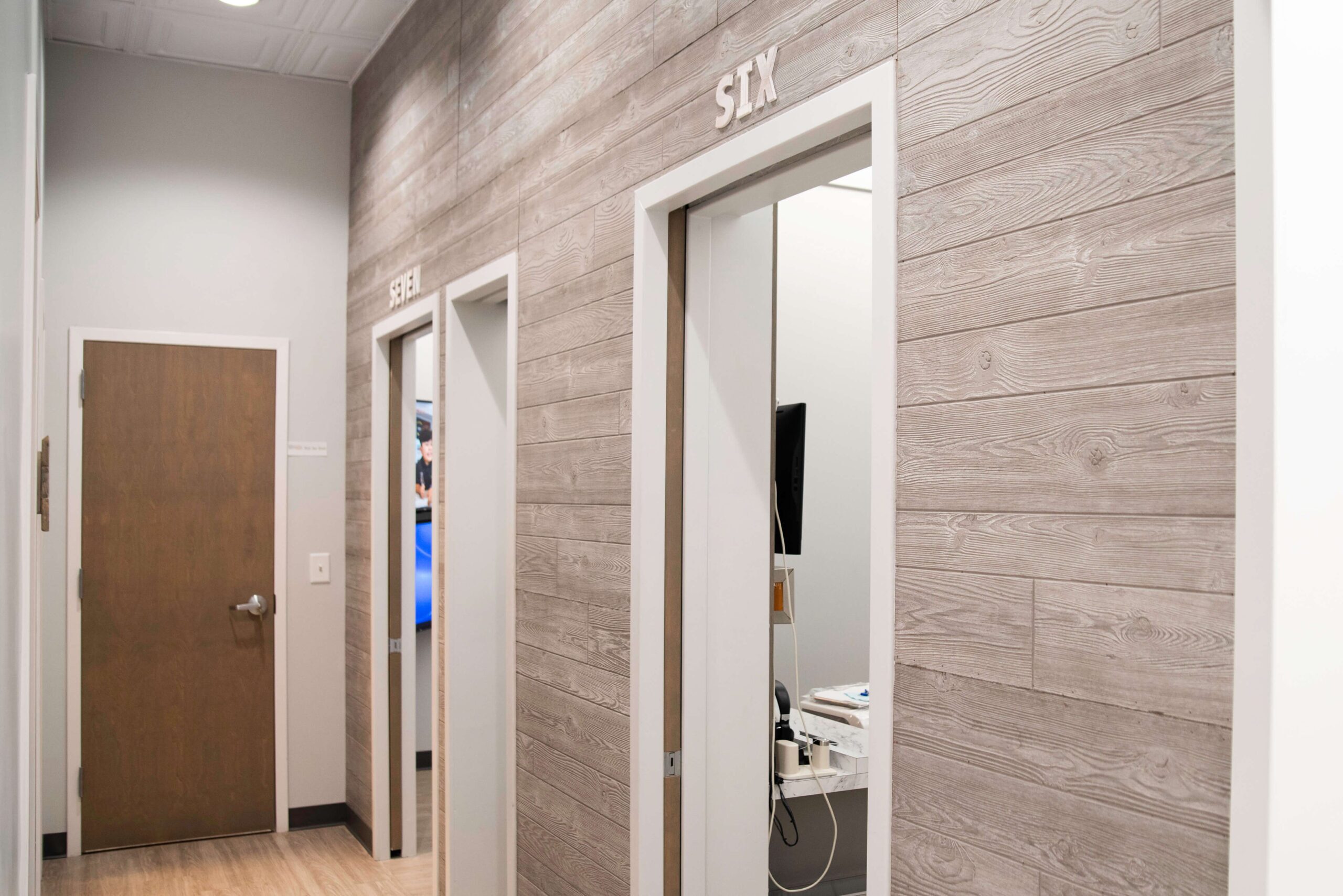 Hallway leading to private dental treatment rooms at O2 Dental Group Durham